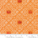 a repeating pattern of orange pumpkins against a white floral background.