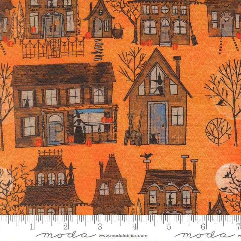 The image is a collage of various Halloween-themed houses and buildings, including a witch's house, a castle, and other spooky and festive structures.