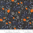 The image is a fabric with a floral pattern featuring orange pumpkins, blue roses, and gray leaves against a dark background.