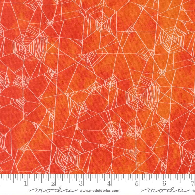 a vibrant, abstract pattern of orange and white lines and shapes, resembling a spider web design.