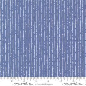The image is a close-up of a fabric with a repeating pattern of vertical lines in various shades of blue.