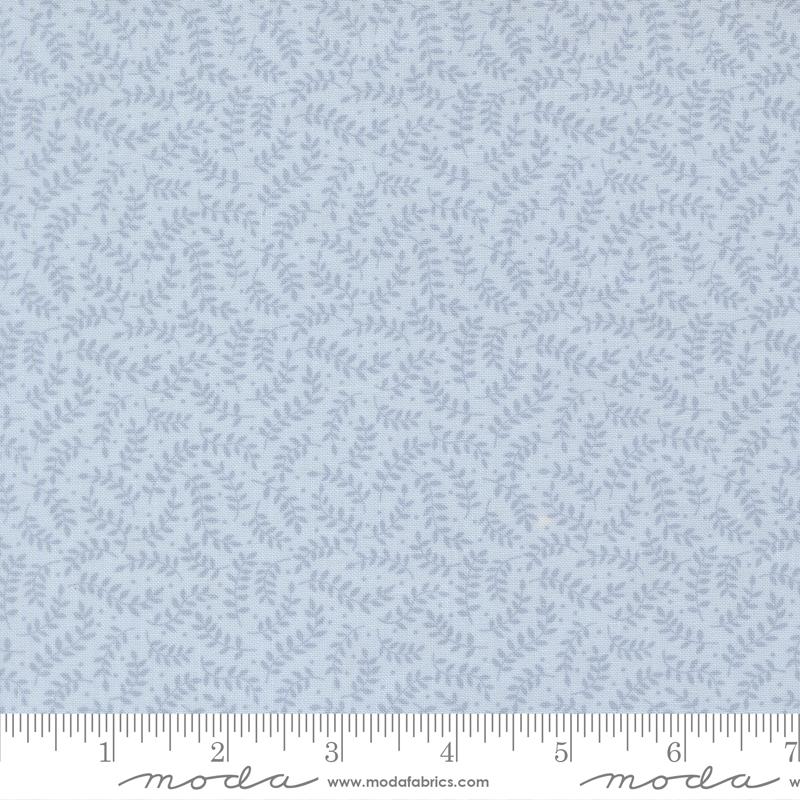 a fabric with a repeating pattern of light blue leaves or branches, creating a textured and leafy appearance.