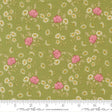 The image is a fabric with a floral pattern of pink roses and white daisies on a green background.