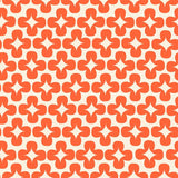 a repeating pattern of orange and white flowers or leaves arranged in a grid-like fashion.