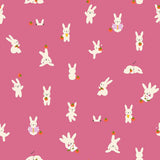 a repeating pattern of white rabbits against a pink background. The rabbits are depicted in various poses, such as standing, sitting, and interacting with objects like carrots. The image does not contain any text or additional objects, and the rabbits are the main focus of the pattern.
