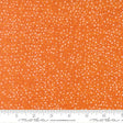 The image is a close-up of a fabric with a pattern of small white dots or specks on an orange background.