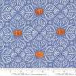a pattern of pumpkins and leaves on a blue background with a white floral design.