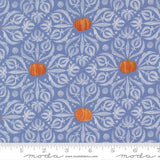 a pattern of pumpkins and leaves on a blue background with a white floral design.