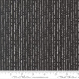 The image is a close-up of a black and white striped fabric with a repeating pattern of vertical lines.