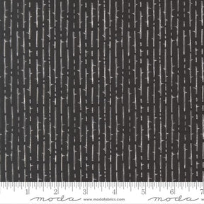 The image is a close-up of a black and white striped fabric with a repeating pattern of vertical lines.