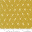 The image is a fabric with a repeating pattern of white acorns on a yellow background.