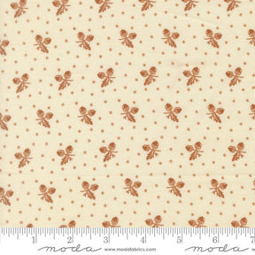 a repeating pattern of brown acorns on a cream-colored background.