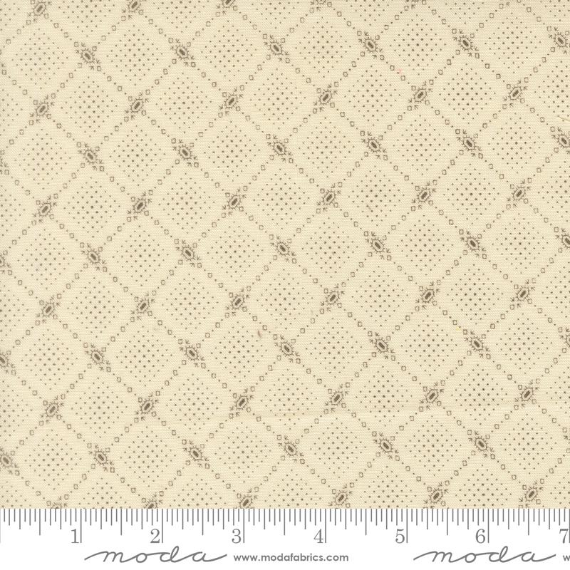 The image is a close-up of a fabric with a diamond pattern, featuring a repeating diagonal grid of small squares or diamonds.