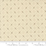 The image is a close-up of a fabric with a diamond pattern, featuring a repeating diagonal grid of small squares or diamonds.
