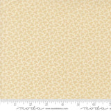 The image is a fabric with a repeating pattern of small yellow flowers or leaves.