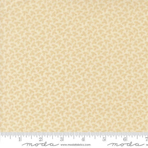 The image is a fabric with a repeating pattern of small yellow flowers or leaves.