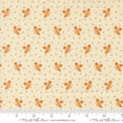 a repeating pattern of orange acorns on a cream-colored background.