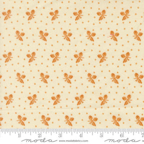 a repeating pattern of orange acorns on a cream-colored background.