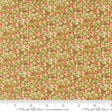 The image is a close-up of a fabric with a floral pattern, featuring small red flowers and green leaves. The fabric appears to be a type of cotton or linen material, with a repeating pattern of flowers and leaves. The image does not contain any text or other discernible objects or actions.