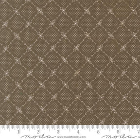 The image is a close-up of a brown fabric with a diamond pattern, featuring small white dots arranged in a repeating diamond shape.