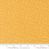 a fabric with a repeating pattern of yellow leaves on a yellow background.