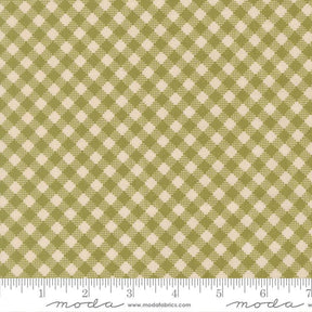 a fabric with a repeating pattern of green and beige squares, creating a checkered or plaid design.