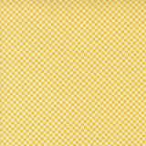 a repeating pattern of yellow polka dots on a yellow background.