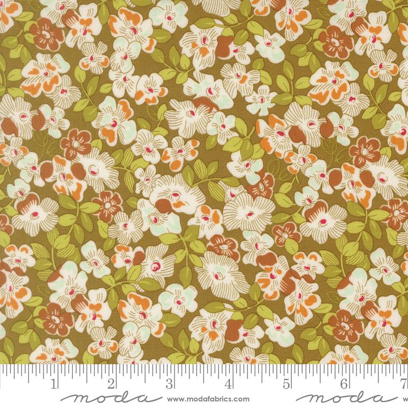 The image is a close-up of a fabric with a floral pattern, featuring various shades of green, brown, and white flowers and leaves.
