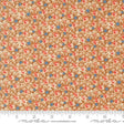 The image is a close-up of a fabric with a floral pattern in shades of brown and orange, with small blue flowers scattered throughout.