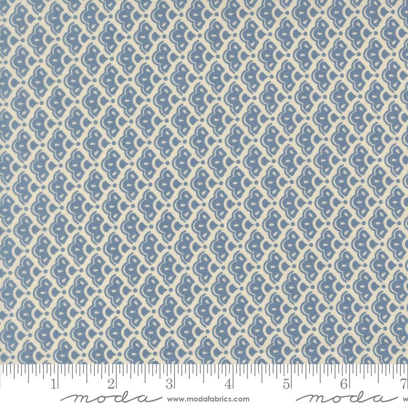a fabric with a repeating pattern of blue and white flowers or leaves. The pattern is arranged in a diagonal grid-like design, creating a visually appealing and intricate pattern.