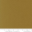 The image is a close-up of a fabric with a polka dot pattern, featuring a brown background with white polka dots.