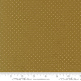 The image is a close-up of a fabric with a polka dot pattern, featuring a brown background with white polka dots.