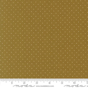 The image is a close-up of a fabric with a polka dot pattern, featuring a brown background with white polka dots.