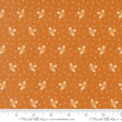 The image is a fabric with a repeating pattern of small white acorns or leaves against an orange background. The pattern is evenly spaced and creates a visually appealing design.