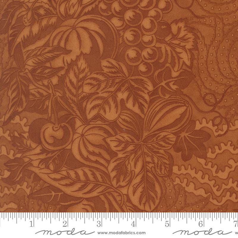 The image is a close-up of a fabric with a detailed brown and orange floral pattern.