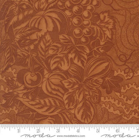 The image is a close-up of a fabric with a detailed brown and orange floral pattern.