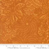 The image is a close-up of a fabric with a floral pattern in shades of orange and brown. The fabric appears to be made of Moda fabric, as indicated by the text in the image.