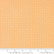 a close-up view of a fabric with a repeating pattern of orange and white squares, creating a textured and visually interesting design.