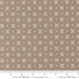 The image is a fabric with a repeating pattern of white crosses and dots on a beige background.