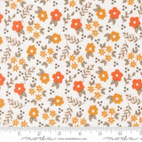 The image is a fabric with a repeating pattern of orange and yellow flowers and leaves on a white background.