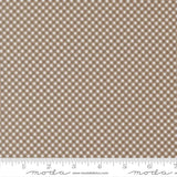 a close-up view of a fabric with a brown and white checkered pattern. The fabric appears to be made of a material with a grid-like texture, which creates a visually appealing and textured appearance.