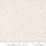 The image is a fabric with a small, multicolored dot pattern.