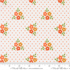 a fabric with a repeating pattern of orange flowers and green leaves against a white background with orange polka dots.