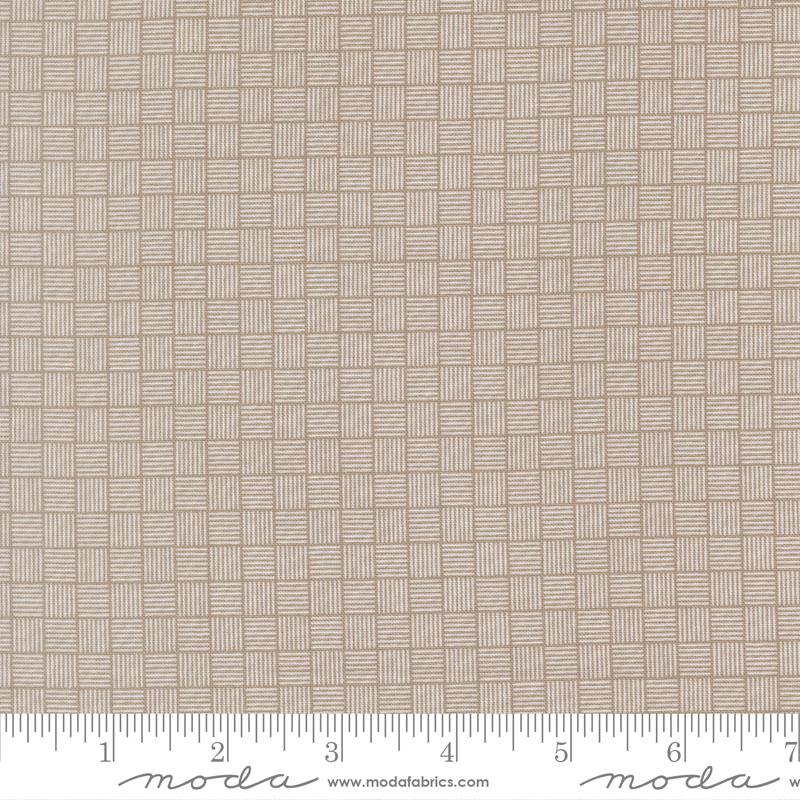 The image is a close-up of a fabric with a woven pattern, featuring a repeating diagonal grid of squares.