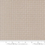 The image is a close-up of a fabric with a woven pattern, featuring a repeating diagonal grid of squares.