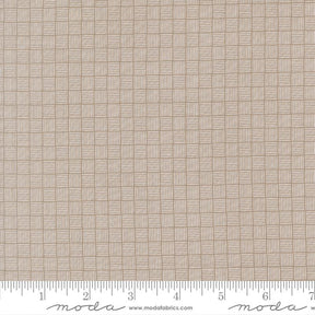 The image is a close-up of a fabric with a woven pattern, featuring a repeating diagonal grid of squares.