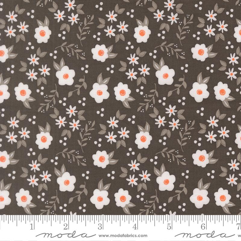 a repeating pattern of white flowers with orange centers against a dark brown background.