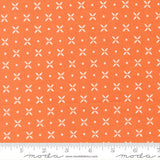 a repeating pattern of white flower-like shapes on an orange background.