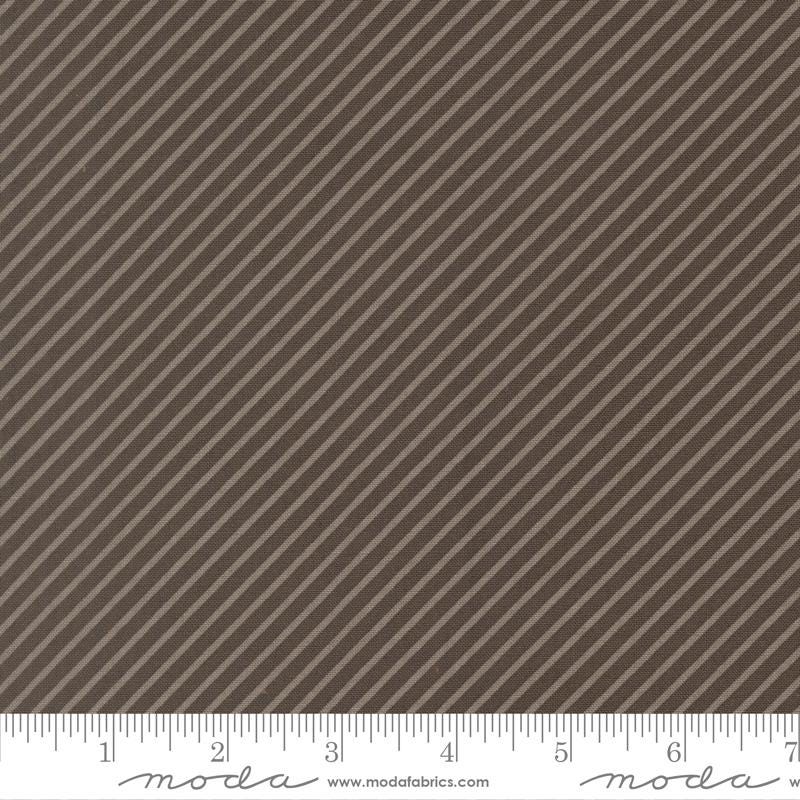The image is a close-up of a brown fabric with diagonal stripes.