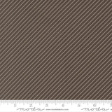 The image is a close-up of a brown fabric with diagonal stripes.